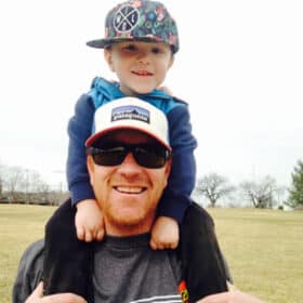 small photo of owner and Coach Scott with child on shoulders Fundamental Youth Sports Littleton Colorado